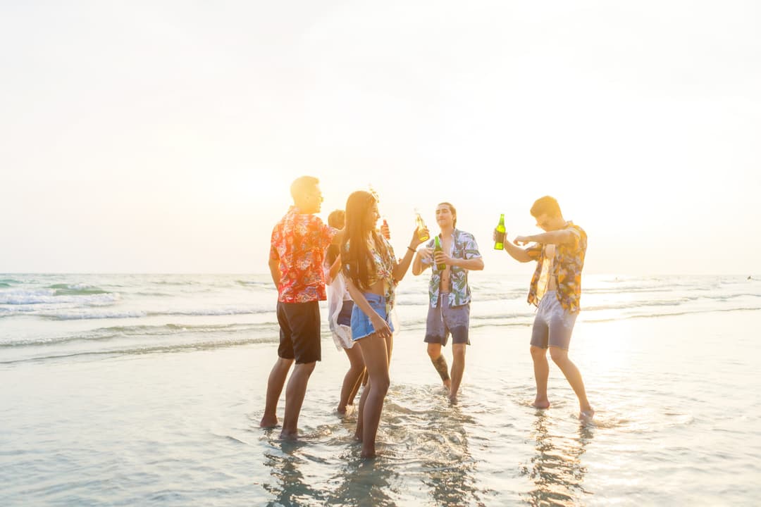 Friends laughing on the beach in Cancun